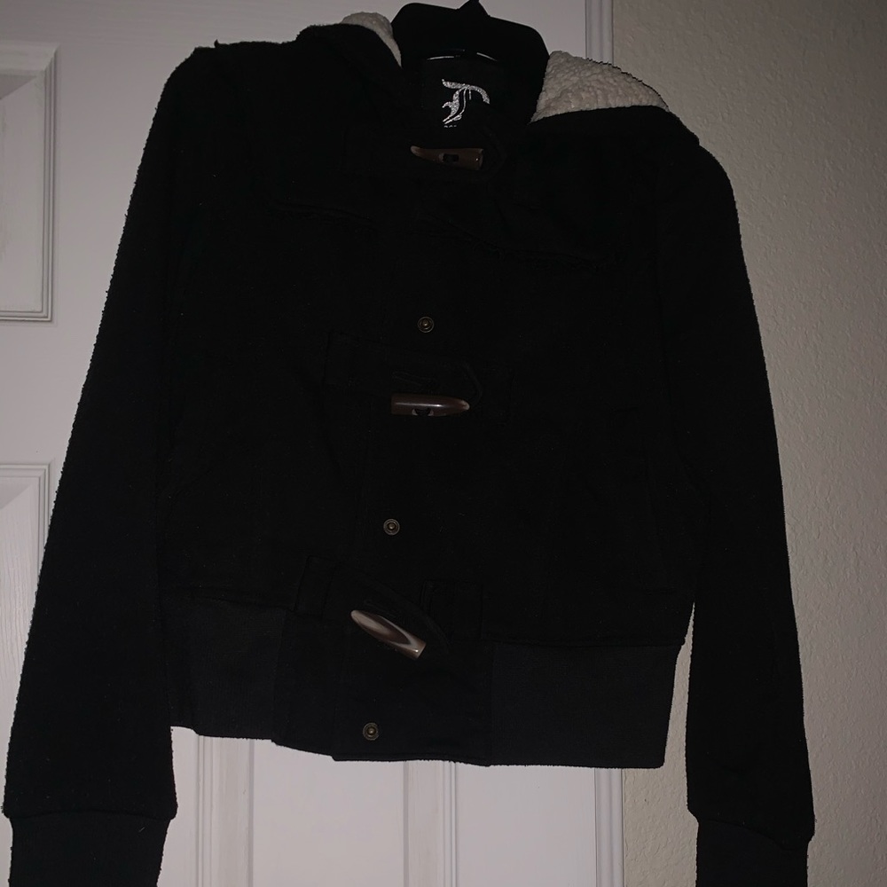 Jacket with long wooden buttons